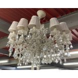 A large twelve branch metal and crystal drop chandelier light fitting, Dia. 82cm, D. 76cm.