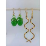 A pair of yellow metal twist drop earrings, L. 5cm together with a pair of apple shaped glass drop