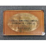 A teak mounted Vickase Armstrong ltd 1995 bronze/brass plaque, frame size 62 x 32cm.