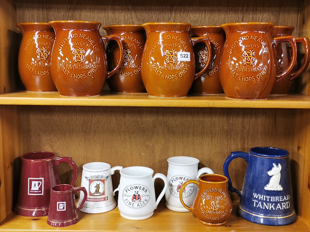 A quantity of ceramic bar related jugs and tankards.