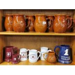 A quantity of ceramic bar related jugs and tankards.