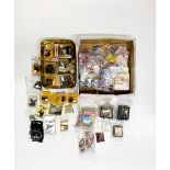 A quantity of boxed wired dolls house fire places including some fire place ornaments, together with