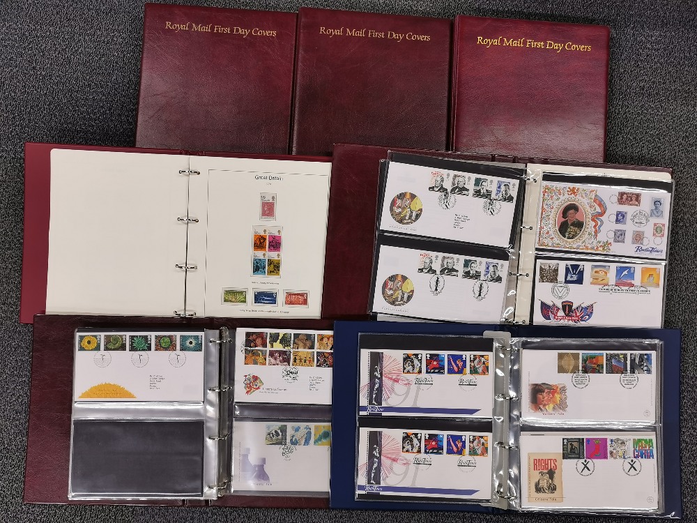 A large box of albums of first day covers.