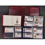 A large box of albums of first day covers.