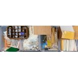 Four boxes containing dolls house building items, including bricks, wall paper, wooden items,