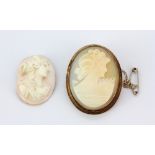 A yellow metal cameo set brooch, L. 4cm, together with an unmounted cameo.