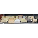 A quantity of dolls house painted wood and metal bedroom furniture items.