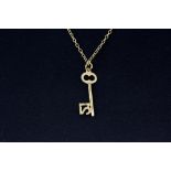 A hallmarked 9ct yellow gold chain and '21' key pendant, L. 40cm. Approx. 2.8gr.