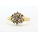 A hallmarked 18ct yellow gold diamond set cluster ring, approx. 0.50ct diamonds, (N).