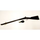 A 19thC Musket with twist steel barrels 75cm, rosewood stock and ram rod and V.6C leather powder