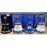 Four unopened Bell's commemorative whiskey decanters.