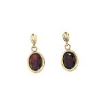 A pair of 9ct yellow gold drop earrings set with oval cut garnets, L. 1.5cm.