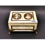 A continental ivory covered music box inset with two handpainted portrait