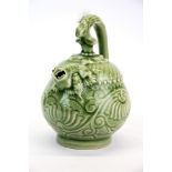 A Chinese incised and celadon glazed porcelain mystery teapot, H. 18.5cm.