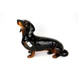 A large Beswick figure of a dachshund, L. 34cm H. 27cm.