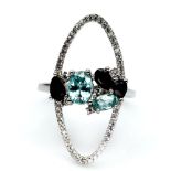 A matching 925 silver ring set with blue topaz and sapphires, (O).