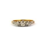 An 18ct yellow gold and platinum ring set with brilliant cut diamonds, (M).