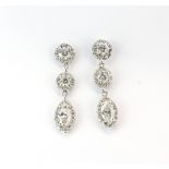 A pair of 18ct white gold (stamped 750) drop earrings set with brilliant and marquise cut