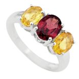 A 925 silver ring set with oval cut garnet and citrines, (O).