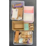 Two boxes of dolls house building items, including doors, windows, wooden panels, etc, three dolls