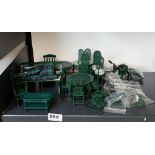 A quantity of dolls house green painted metal garden furniture, including a bicycle.