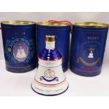 Three unopened Bell's whiskey Royal decanters.