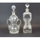 Two interesting Victorian decanters, one with hallmarked silver rim, H. 28cm.