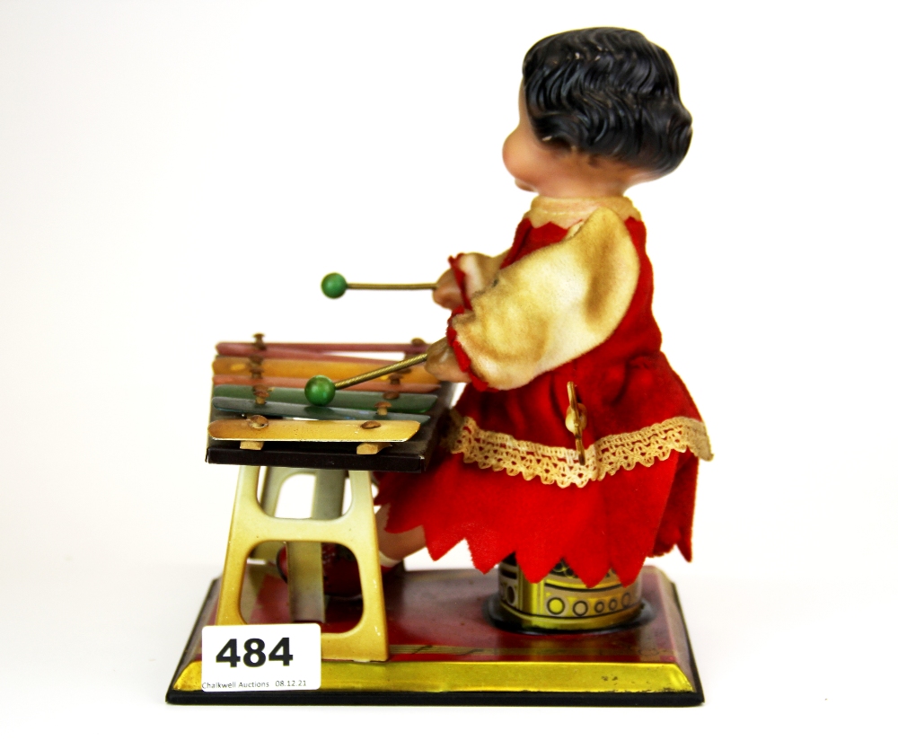 A vintage mechanical tin and celluloid toy (in working order) H. 22cm. - Image 2 of 2