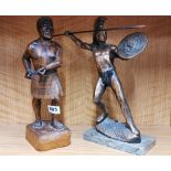 A carved wooden figure of a M?ori warrior, H. 33cm. Together with a metal figure of a gladiator.