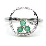 A 925 silver ring set with emeralds and white stones, (N).