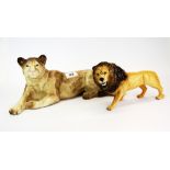 A Beswick figure of a lion and a large Melba Ware figure of a lioness, lioness 38 x 15cm.