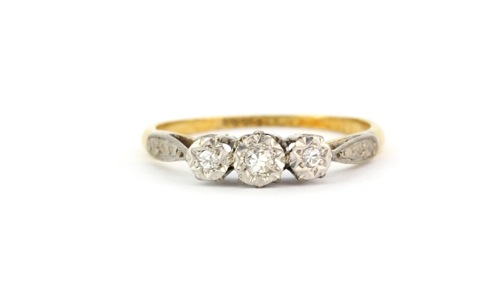 An 18ct yellow gold and platinum ring set with three old cut diamonds, (O).