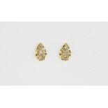 A pair of 18ct yellow gold diamond set stud earrings, L. 0.5cm.