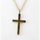 A 9ct yellow gold (stamped 9k) chain with a yellow metal cross pendant (tested gold), L. 64cm.