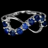 A 925 silver sapphire set infinity shaped ring, (K).