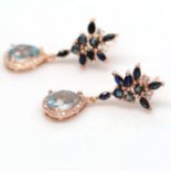 A pair of 925 silver rose gold gilt drop earrings set with pear cut blue topaz and sapphires, L. 3.