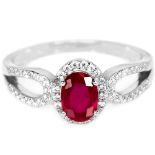 A 925 silver ring set with an oval cut ruby and white stones, (O).