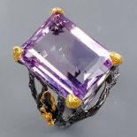 A 925 silver ring set with a large emerald cut amethyst, (R).