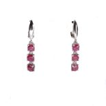 A pair of 925 silver drop earrings set with round cut rubies, L. 3.4cm.