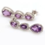 A pair of 925 silver drop earrings set with pear cut amethysts and white stones, L. 3cm.