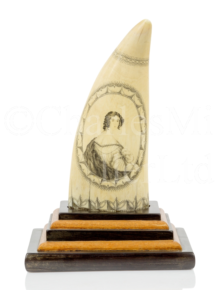 Ø AN EXCEPTIONALLY FINE SCRIMSHAW DECORATED WHALE’S TOOTH BY THE BANKNOTE ENGRAVER, CIRCA 1835