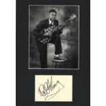 BB King signature piece mounted below black and white photo. Approx overall size 16x12. We combine