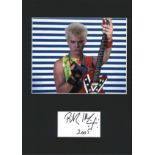 Billy Idol signature piece mounted below colour photo. Approx overall size 16x12. We combine postage