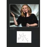 Adele signature piece mounted below colour photo. Approx overall size 16x12. We combine postage on