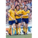 Autographed BRIAN TALBOT 12 x 8 photo - Col, depicting Talbot being congratulated by Arsenal team