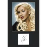 Christina Aguilera signature piece, mounted below colour photo. Approx overall size 16x12. We