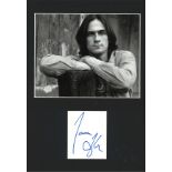 James Taylor signature piece mounted below black and white photo. Approx overall size 16x12. We