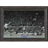 Bryan Robson 10x8 signed black and white photo pictured in action for Manchester United, framed.