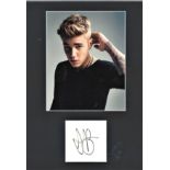 Justin Bieber signature piece mounted below colour photo. Approx overall size 16x12. We combine