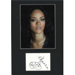 Rihanna signature piece mounted below colour photo. Approx overall size 16x12. We combine postage on